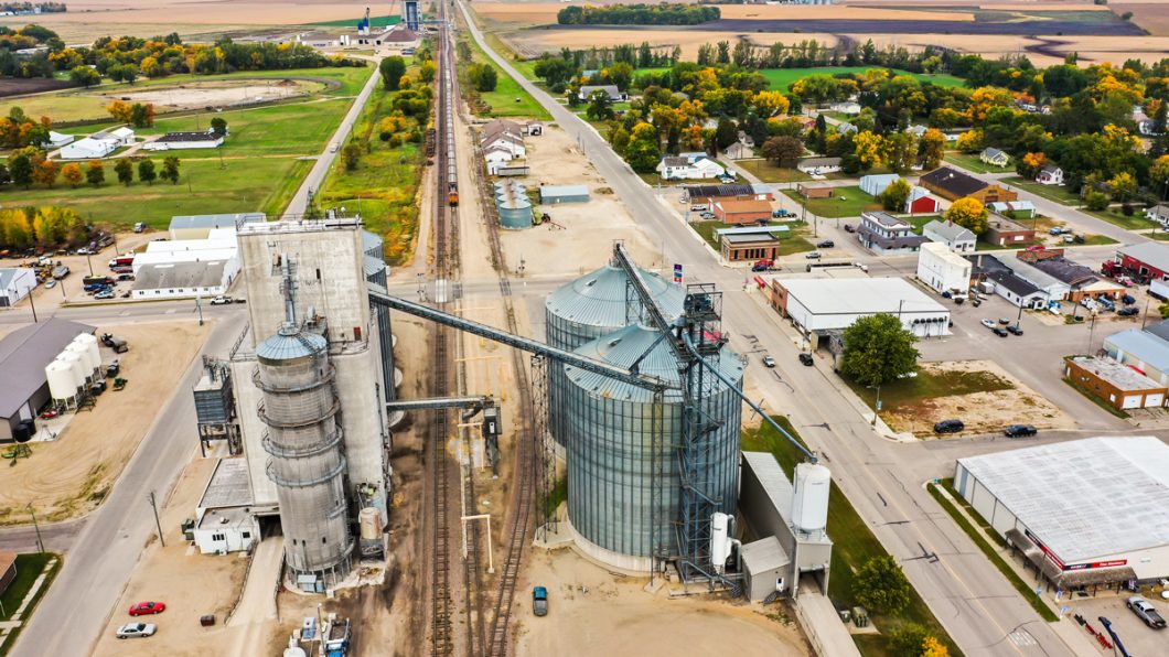 Aerial view of a grain elevator and surrounding countryside