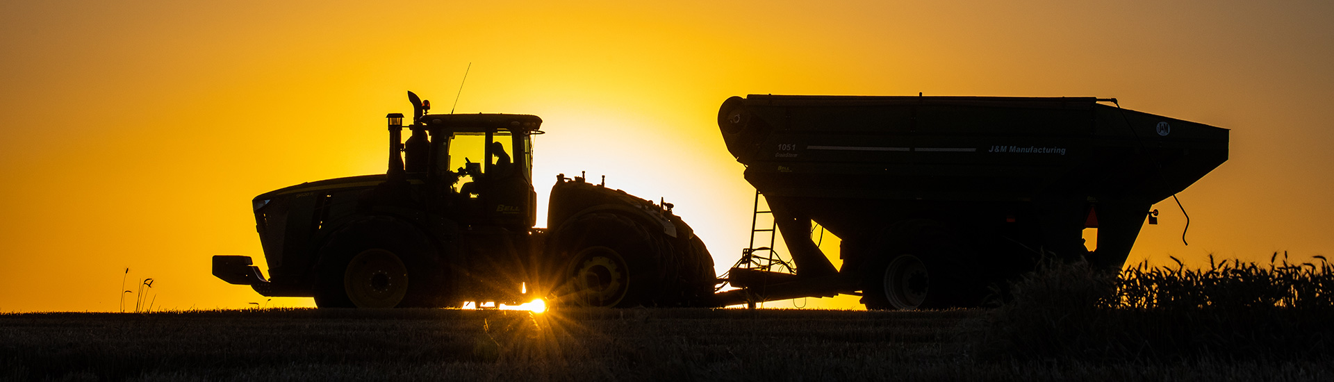 grain cart in the sunset